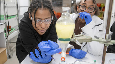 student working on science project