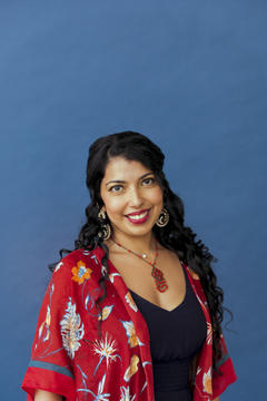 Prema headshot wearing red robe