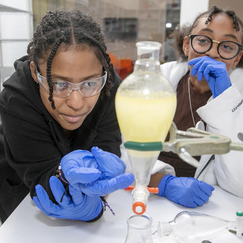 student working on science project