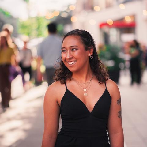 woman in street smiling