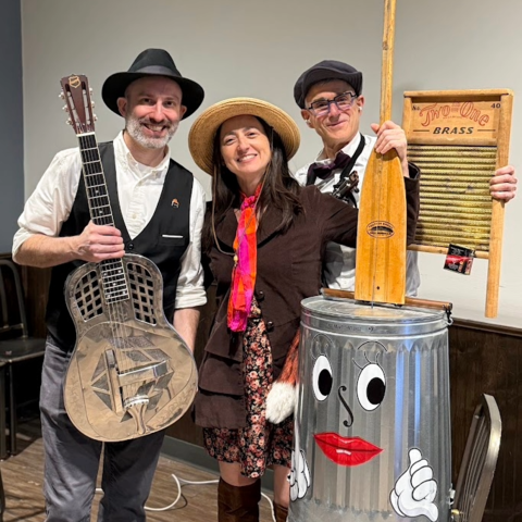 3 band members posing with unique instruments