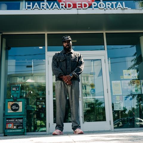 Man stands outside in front of Harvard Ed Portal entrance
