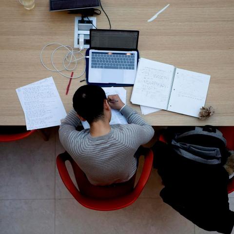 Student doing work at desk