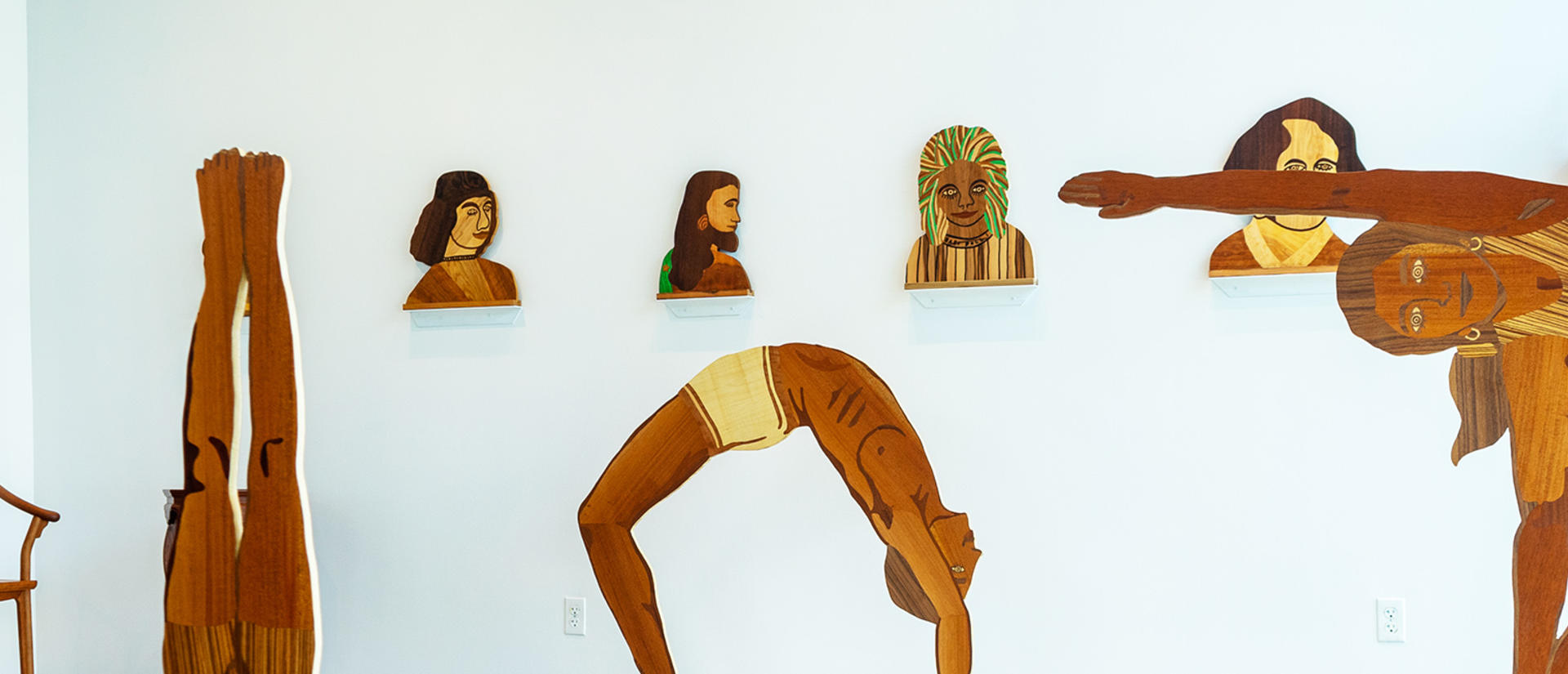 wooden figures in art exhibition by Hugo Nakashima-Brown