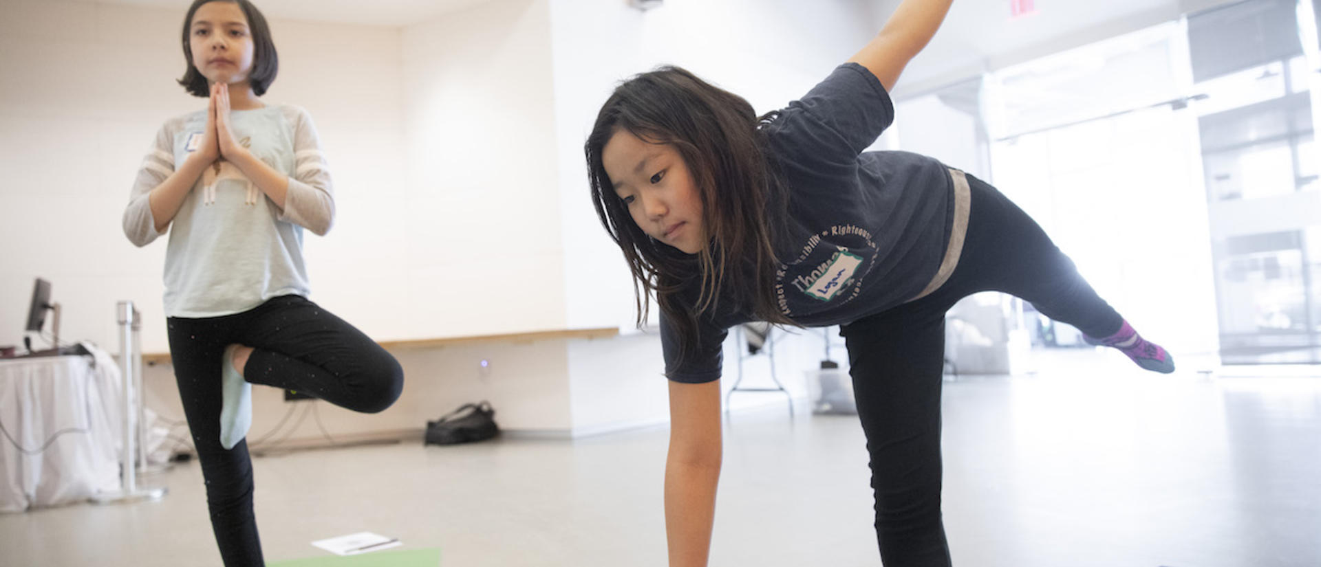 Local students practicing yoga poses.