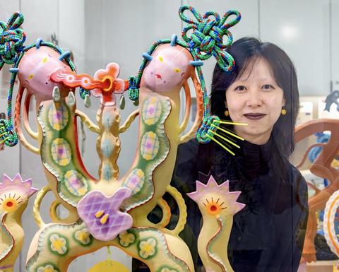 Chenlu Hou with art sculpture